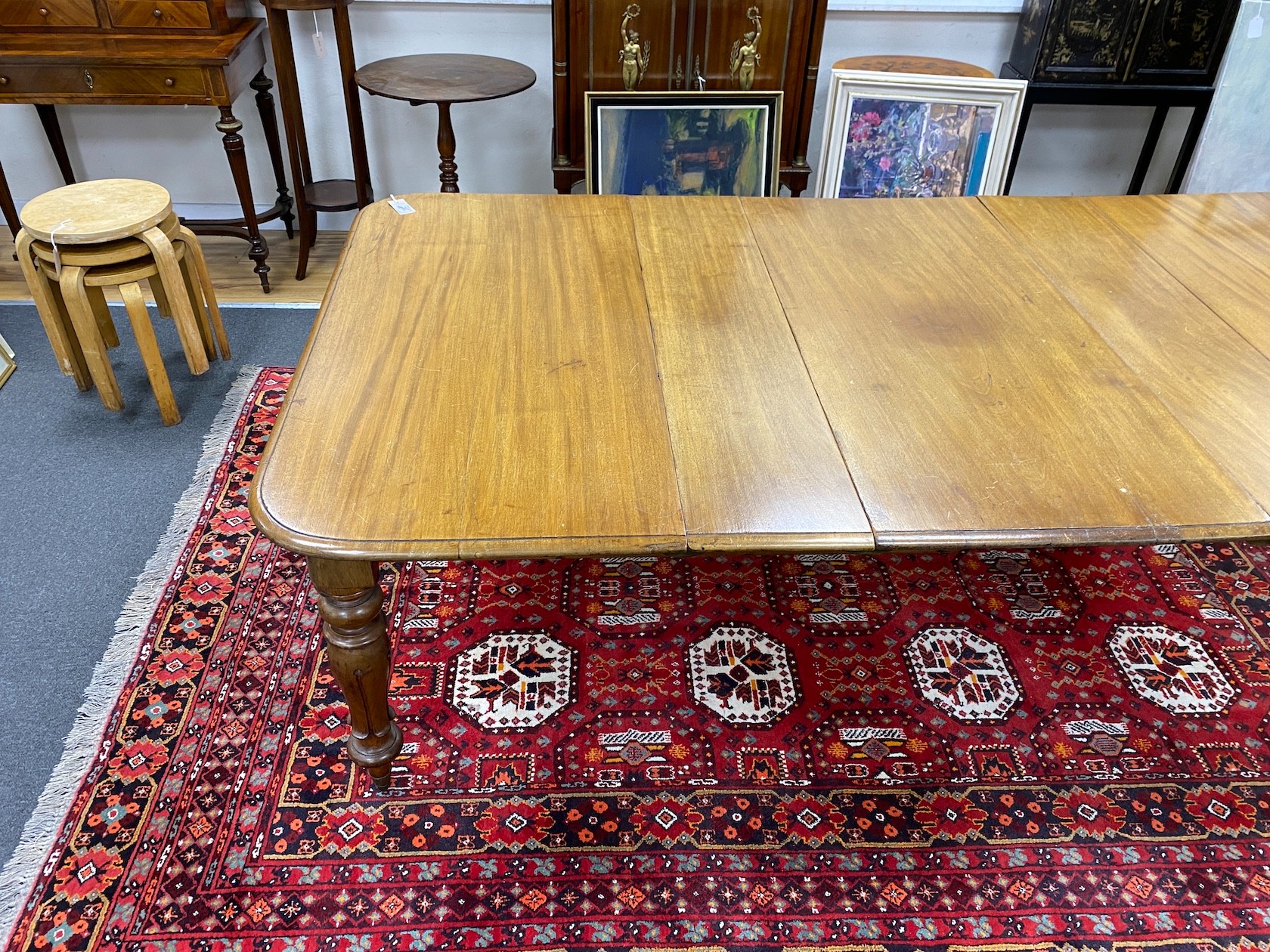 An early Victorian mahogany rectangular extending dining table, length 220cm extended, three spare leaves, width 120cm, height 73cm